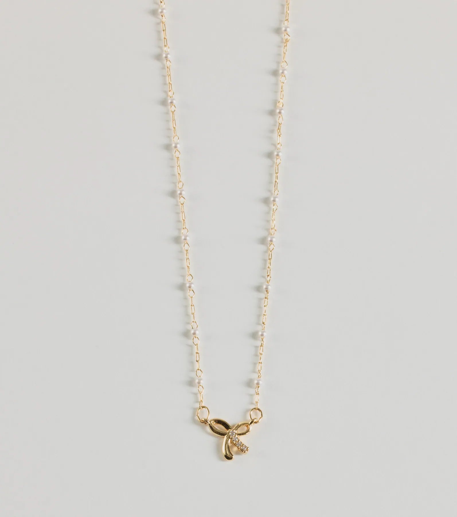 Ultimate Glamour Bow Charm Necklace with Faux Pearls